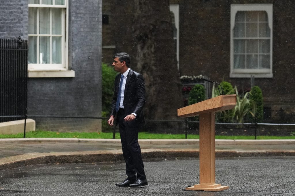 A drenched Rishi Sunak announcing the General Election.